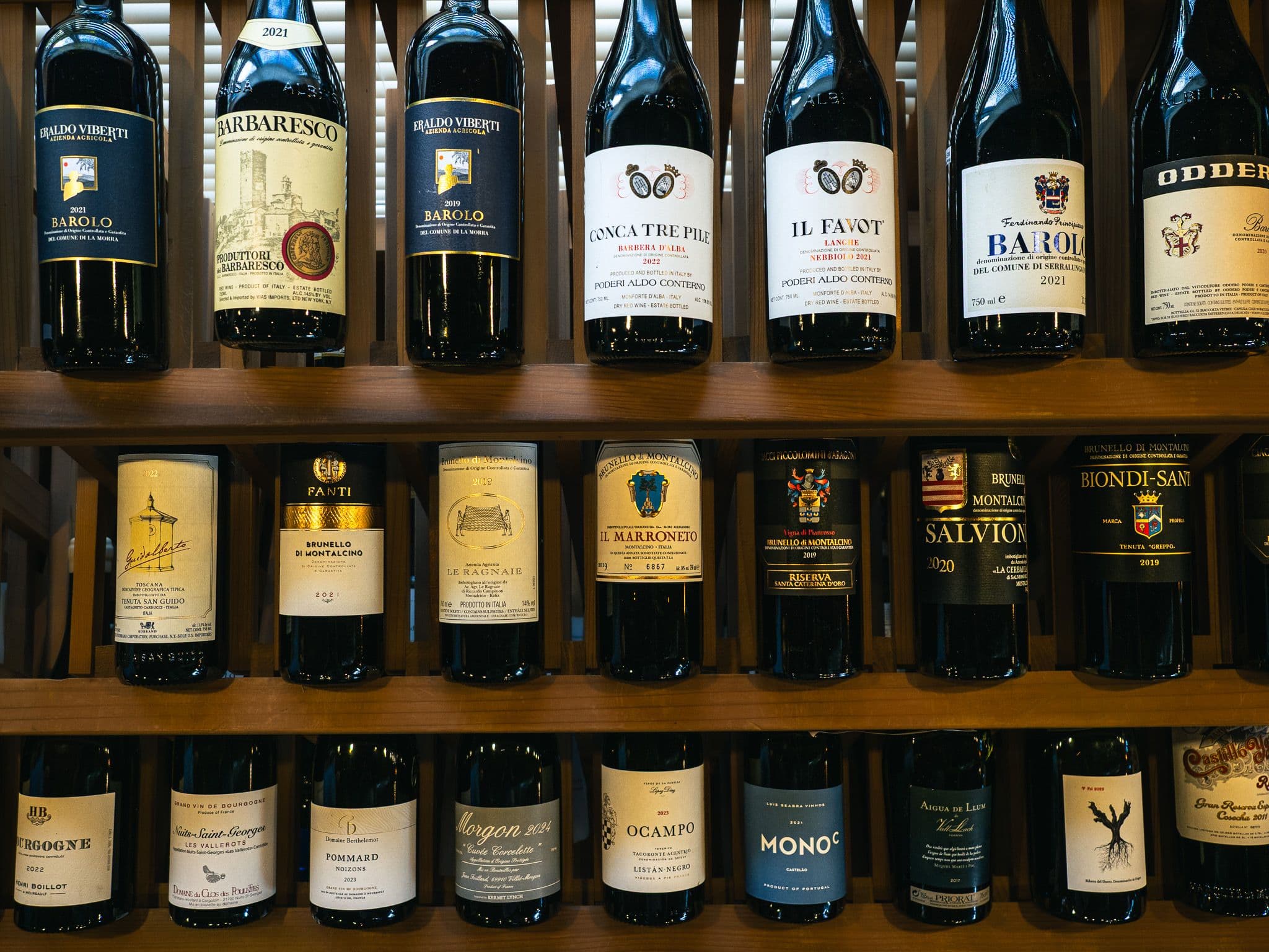 The wall of bottles inside The Clown, our wine and spirits shop on US Route 1 in York, Maine